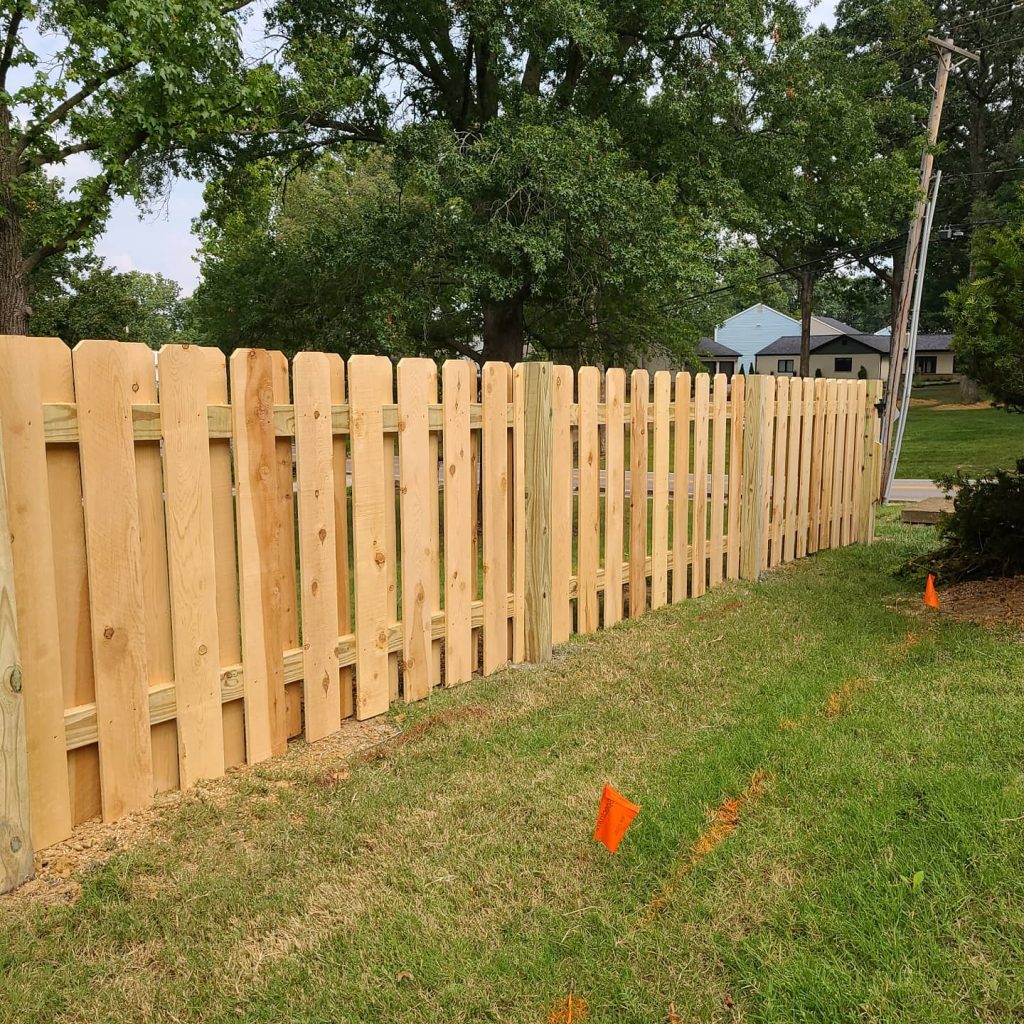 wood fence and underground lines marked